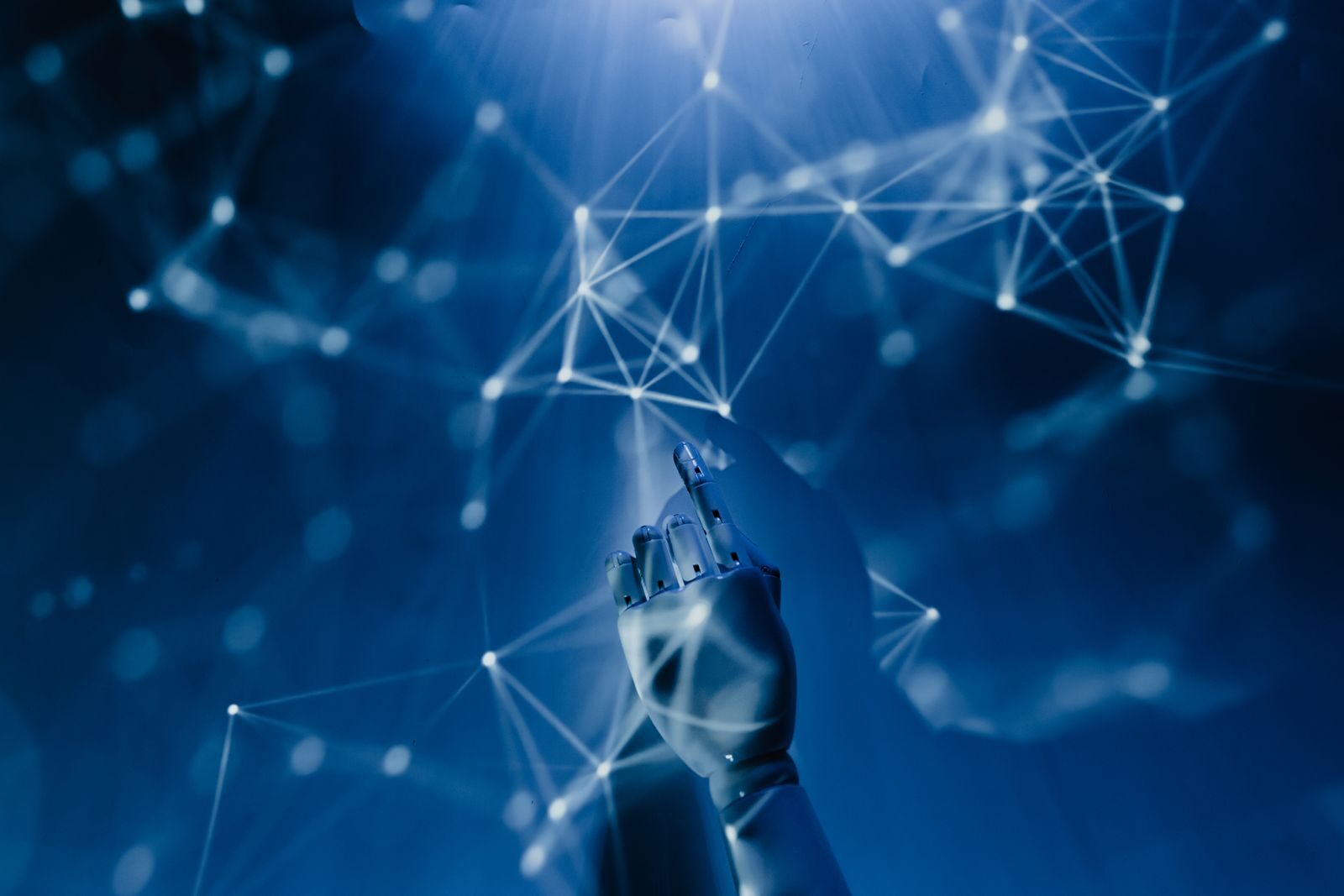 Robotic hand reaching towards a digital network, representing AI automation